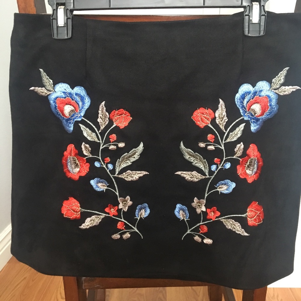 Thick embroidered and form fitting skirt.